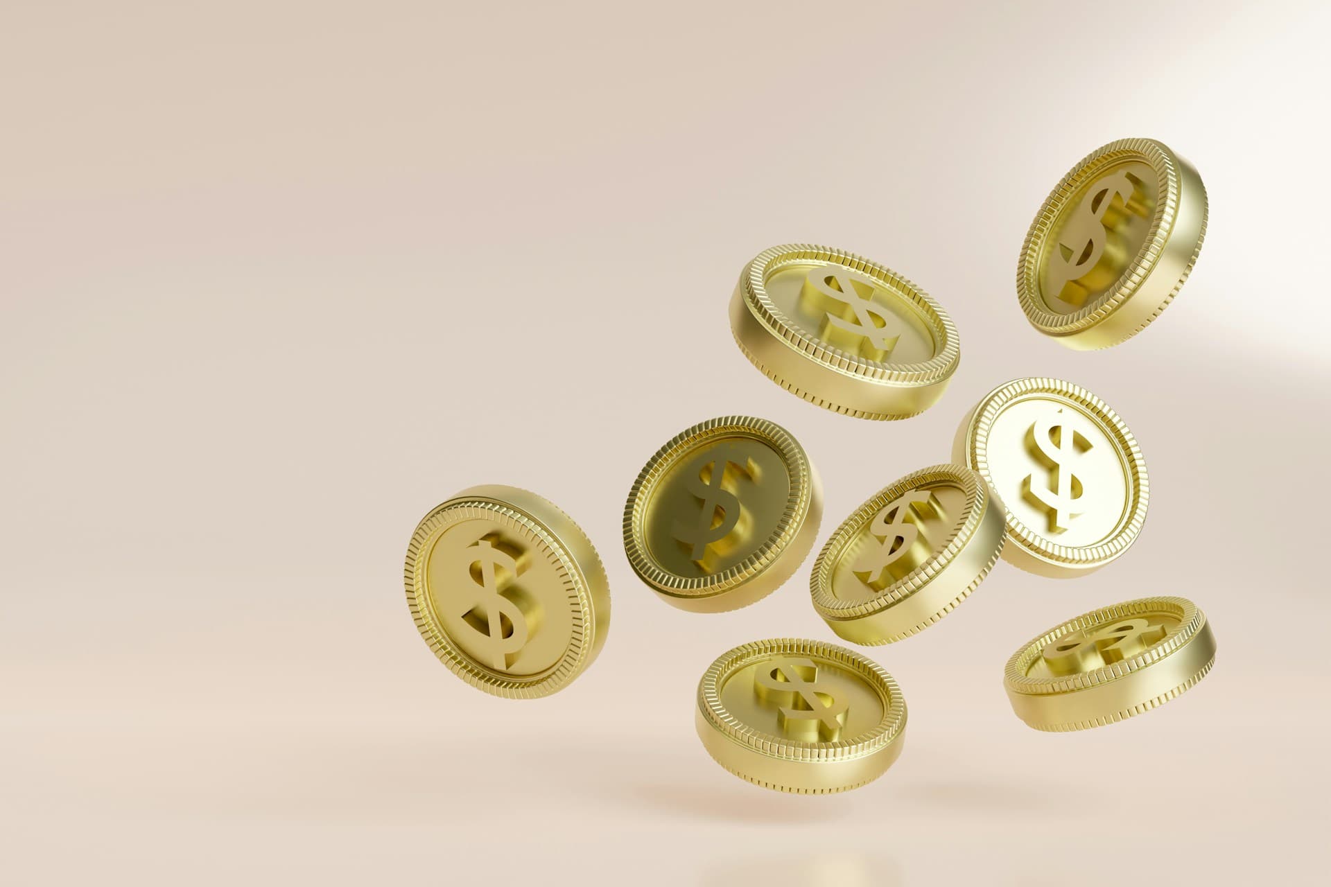 ドルマークの描かれたいくつかの金色のコインが宙を舞っているCG画像